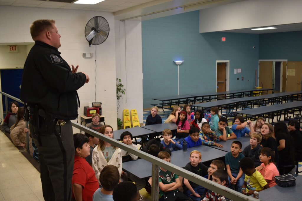 Speaking to the kids photo.