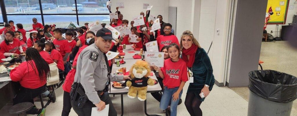 Photo of kids with D.A.R.E. certificates right section.